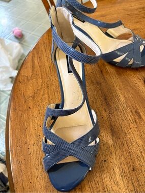 Alex Marie navy blue leather ankle strap crisscross stiletto sandals.